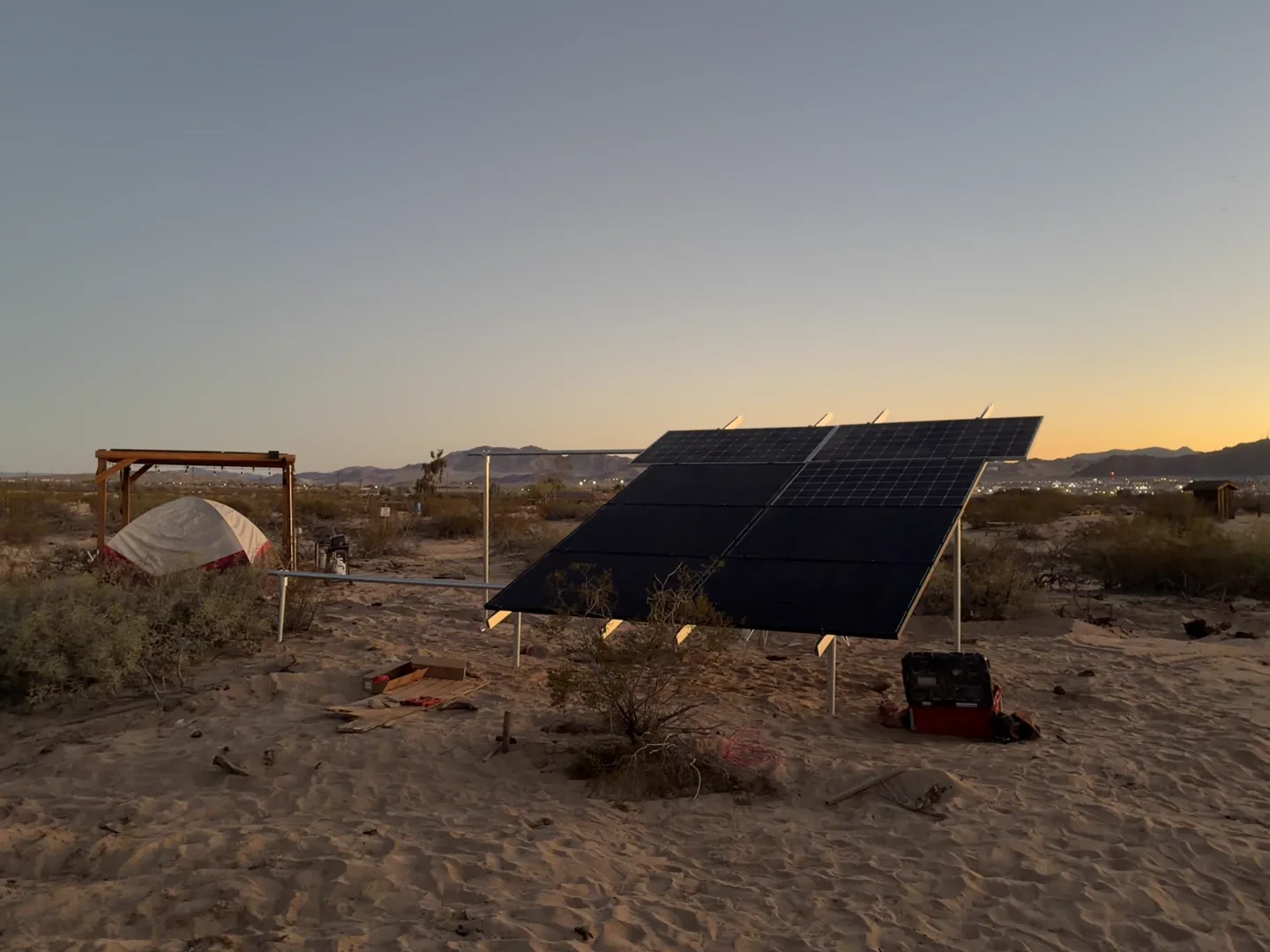 Solar panels and the open desert at Camp Warner at sunset